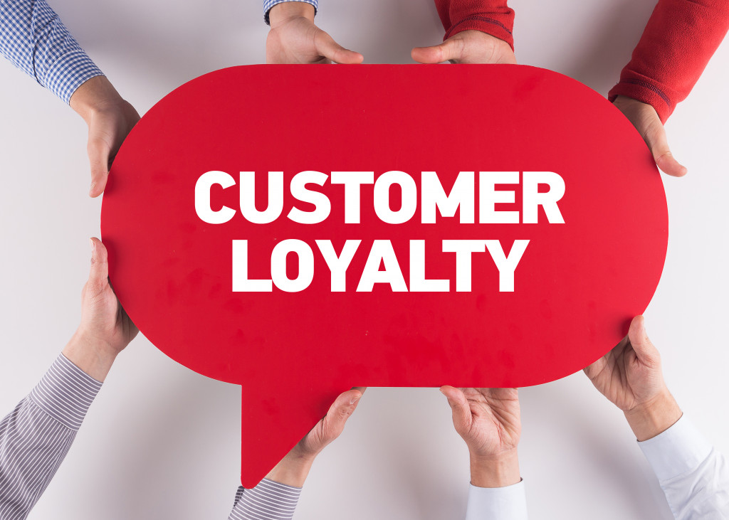 holding a customer loyalty speech bubble