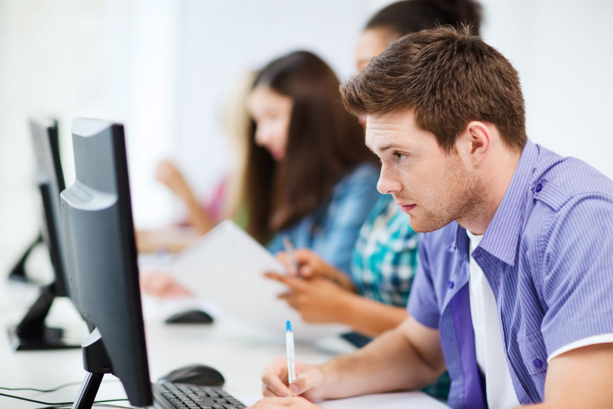 young adult studying on computer