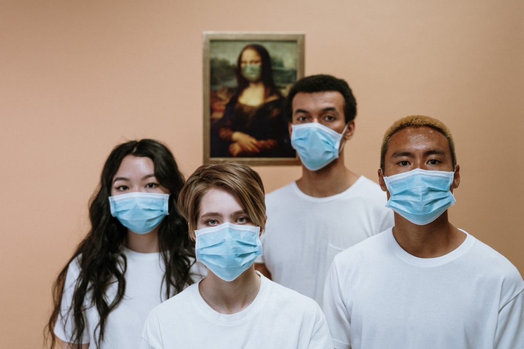 a group of friends wearing face masks