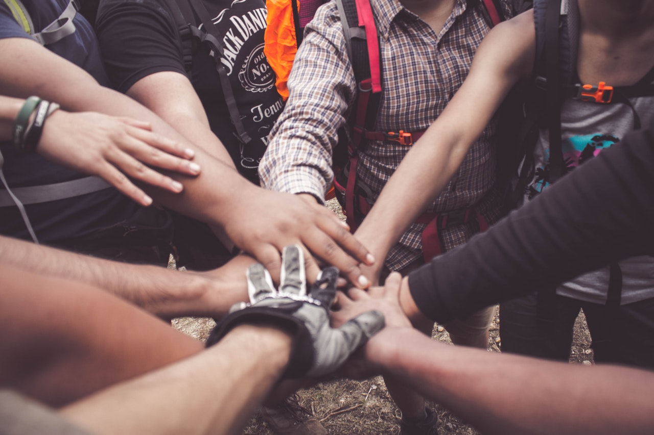 people putting their hands together