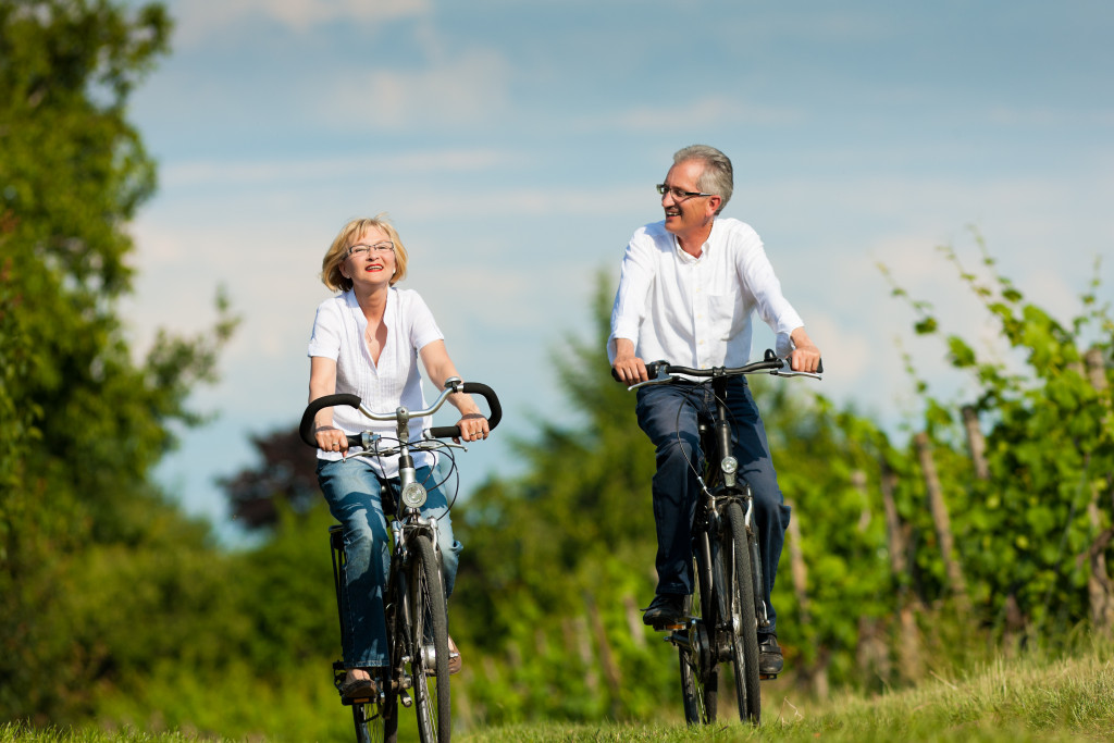 mature couple riding a bike