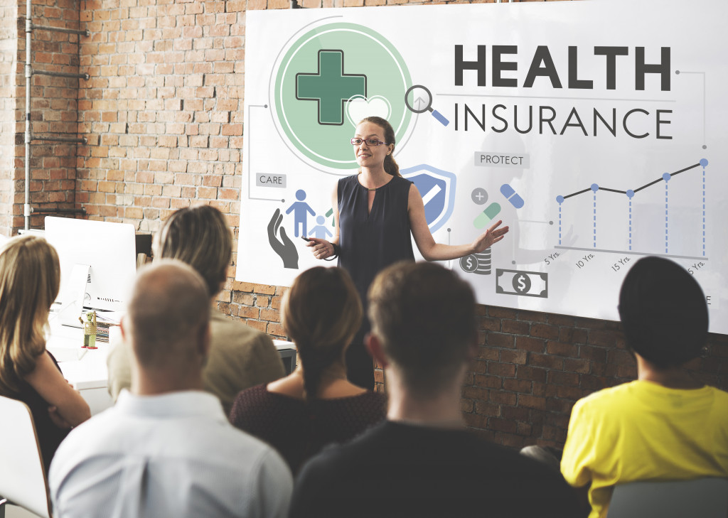 An insurance saleswoman giving a seminar